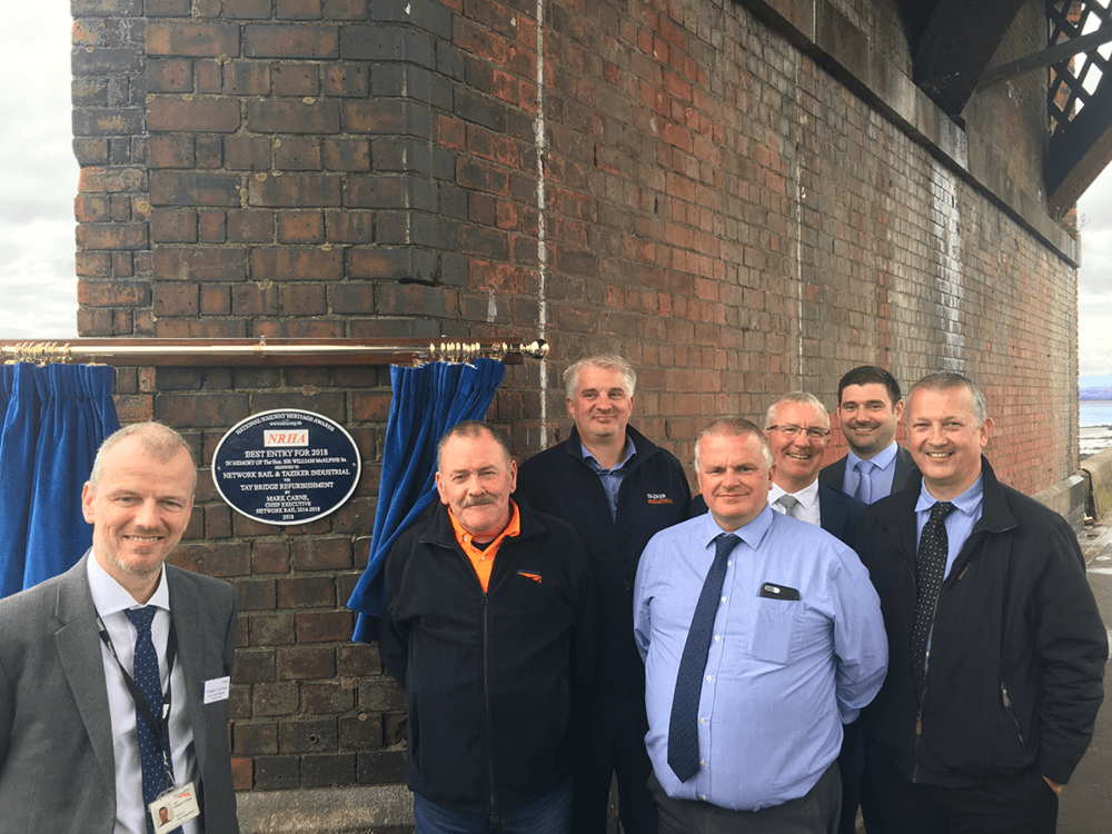 Taziker team in front of the Tay Bridge NRHA Best Entry Award plaque.