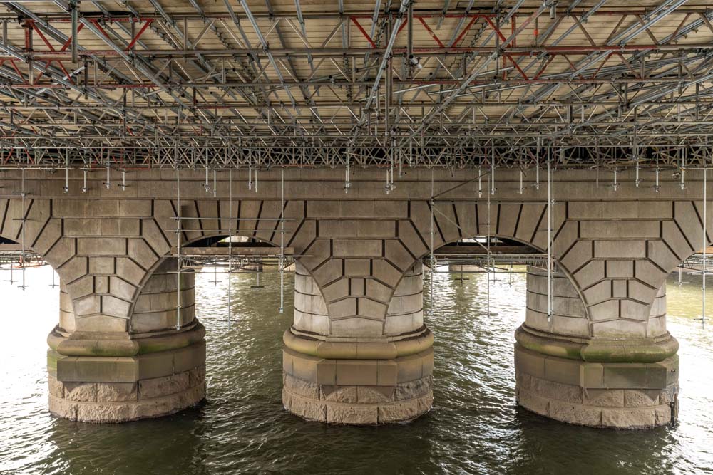 Scaffolding underneath Caledonian Railway Bridge over River Clyde.